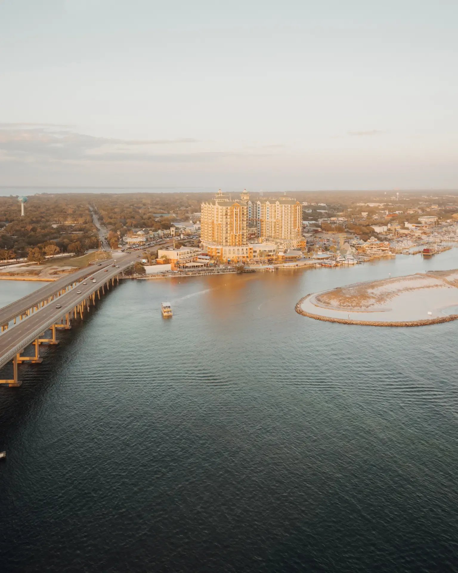 Destin Harbor and the Emerald Grande at golden hour, Destin, Florida